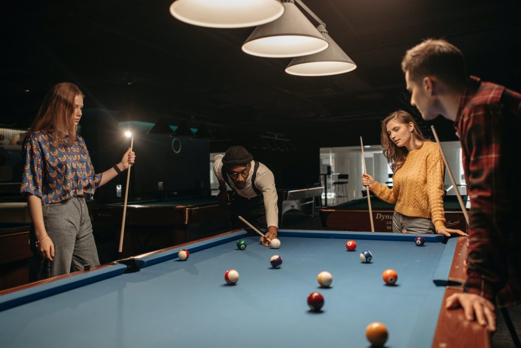 Learning How to Play Billiards 4 A Man in White Long Sleeves Playing Billiards