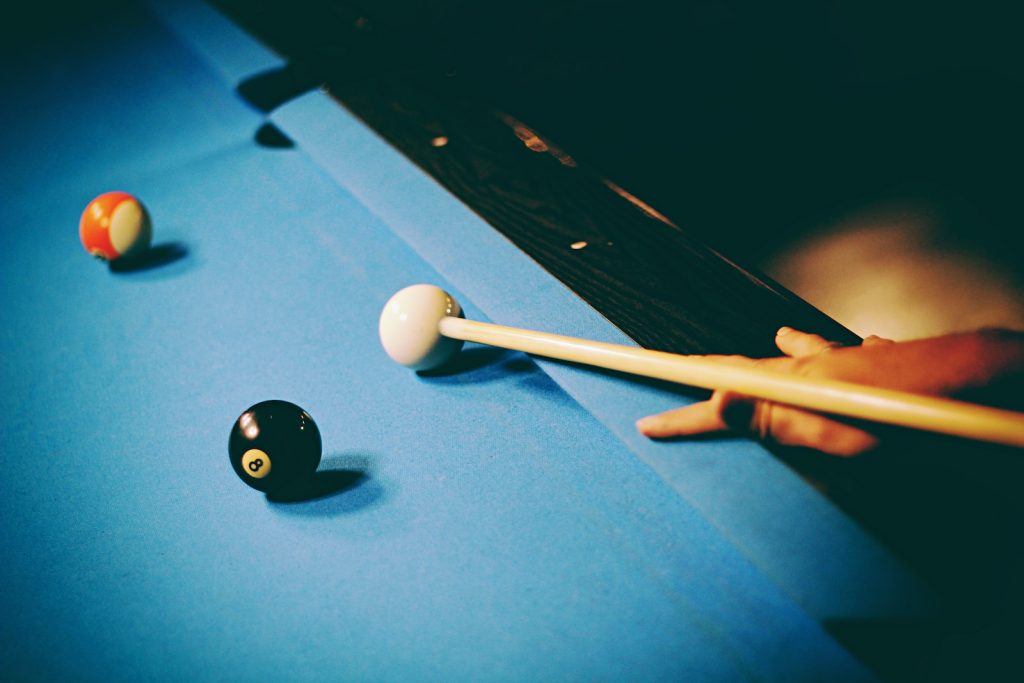 How to Play 8-Ball Pool 3 person playing billiard